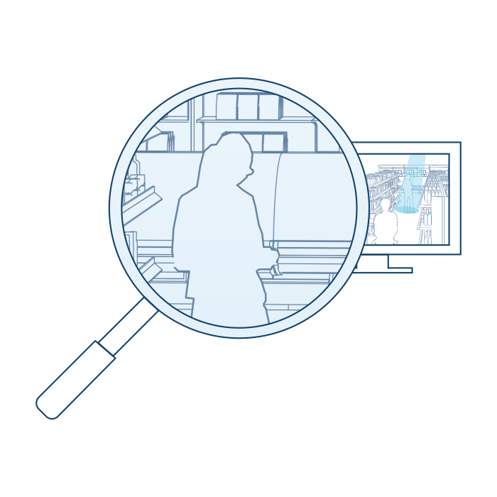 A surveillance monitor with a magnifying glass overlaid on the screen, zooming in on a specific area. The magnified section shows the silhouette of an individual standing in front of shelving with various items, suggesting close monitoring or detailed examination within a surveillance context.